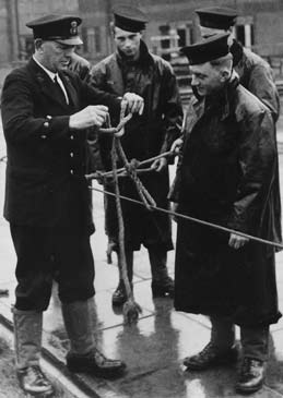 Sailors in Oilskin Coats